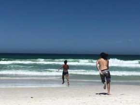 Três quartos na praia